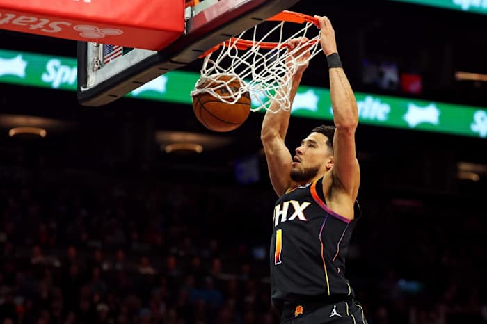 Phoenix Suns guard Devin Booker (1) dunks the ball during the first quarter against the Sacramento Kings at Footprint Center.